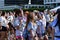 Smeared with colored dyes, young people having fun at the Color Manila Glitter Run