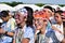 Smeared with colored dyes, young people having fun at the Color Manila Glitter Run