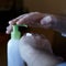 Smearing moisturizer on damaged hands of a cream jar with dispenser