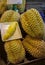 Smelly large durian fruits Thai night market street food Bangkok