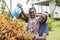 Smile african girl help her mother water the plants at outdoor her home garden. - happy family lifestyle concept