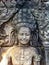 A smile on Apsara\\\'s face carved at Bayon Castle, Angkor Thom, Siem Reap, Cambodia