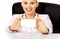 Smile business woman sitting behind the desk and holding empty buisiness card