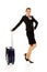 Smile businesswoman dragging wheeled suitcase