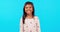 Smile, emoji and face of girl in studio with happiness, excited and young children on blue background mockup. Portrait