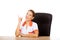 Smile female doctor sitting behind the desk and pointing up