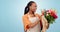 Smile, florist and black woman smell flowers in studio isolated on blue background mockup. Portrait, bouquet and