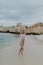 Smile Freedom and happiness woman on beach enjoying serene ocean nature during travel holidays vacation outdoors.