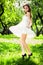 Smile girl dance in white dress