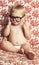 Smile, glasses and fun baby in studio with vision, eye care and health for child development. Happy, cute and young