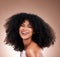 Smile, hair and beauty portrait of black woman on brown background for wellness, shine and natural glow. Salon, luxury