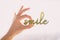 Smile home decor decoration object for home positivity wellness. Happy woman hand holding sculpture written SMILE in