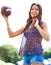 Smile, sports and woman throwing football outdoor on field for fitness, recreation or fun in summer. Sky, camping and