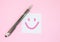 Smile on white To Do List Sticker with pen. Searching information on the Internet..Close up of reminder note paper on the pink