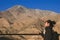 A smiley beautiful Asian woman standing in front of Himalaya mountain