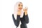 smiley beautiful young muslim woman wearing Hijab and painting her lips with a lipstick with mirror on white background