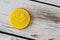 Smiley biscuit on wooden background.
