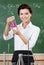 Smiley chemistry teacher hands an Erlenmeyer flask