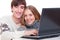 Smiley couple with laptop