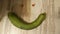 Smiley of curved zucchini with strawberry eyes.