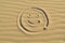 Smiley drawn in the sand