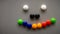 Smiley emoji using the colorful fridge magnet on the refrigerator