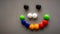 Smiley emoji using the colorful fridge magnet on the refrigerator