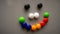 Smiley emoji using the colorful fridge magnet on the refrigerator