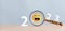 Smiley face on 2023 year concept. Magnifier focus to yellow emoticon face. happy to next year from end 2022, New year