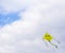 Smiley Face Kite Flying in a Cloudy Skiy