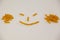 Smiley face made out of pennette pasta