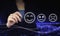 Smiley Face Rating for a Satisfaction Survey. Hand holding digital graphic pen and drawing digital hologram Smiley Face sign on