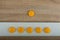 smiley-faced group of sad emojis against the background of a wooden table. Be positive.