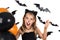 Smiley girl with black cat costume, halloween makeup and black and orange balloons at halloween party, pumpkin patch. Halloween ki