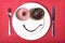 Smiley happy face made on dish with donuts eyes and chocolate syrup as smile in sugar and sweet addiction nutrition