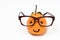 Smiley orange wearing the eyeglasses on white backgrounds. cartoon emotion face orange isolated