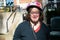 Smiling 41 yo woman with the Down Syndrome, wearing a bike helmet, Tienen, Belgium