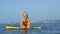 Smiling adorable child enjoying blue sea surfboarding bodyboard. Slow motion