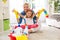 Smiling adorable family ready for cleaning house