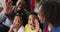 Smiling african american family sending kisses on video call, christmas decorations in background