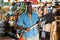 Smiling african american gardener buying shovel in gardening market