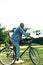 smiling african american man riding retro bicycle