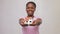 smiling african american woman holding house model