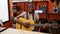 Smiling african american woman plays a classic melody on her guitar indoor