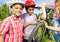 Smiling African boys in helmets repair bike