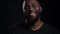 Smiling african man looking at camera indoors. Afro guy making smile in studio