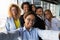 Smiling african woman making selfie with motivated colleagues.