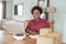 Smiling African woman working on her home based business