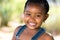 Smiling african youngster outdoors.