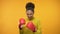 Smiling Afro-American girl in boxing gloves imitating fight, having fun, victory